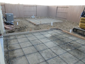 Two pads for patio and shed.